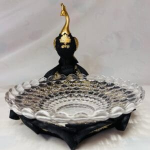 Peacock with crystal glass bowl